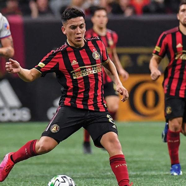 MLS player passing the ball