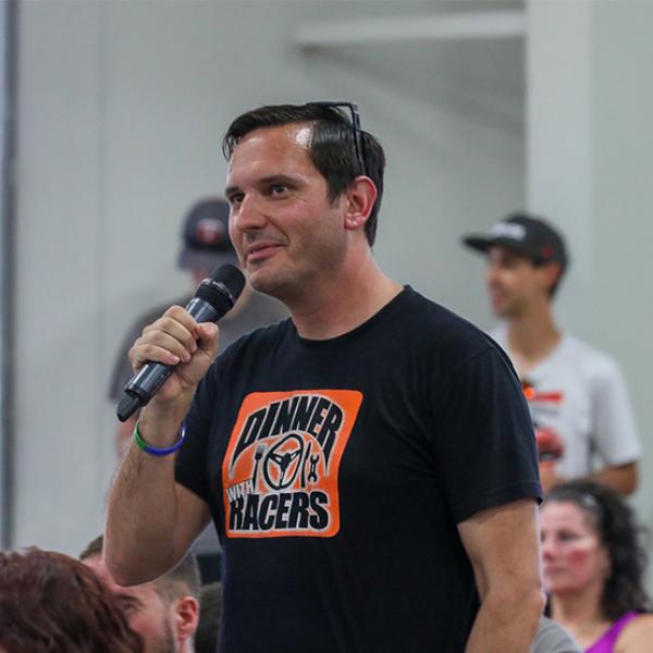 Ryan Eversley holding a microphone