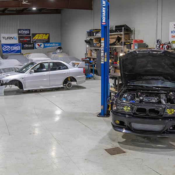 Speed Academy cars being worked on the garage